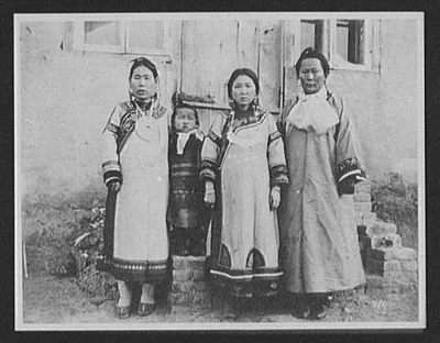 Wives of Goldi chiefs in their best clothes, Russia, 1895