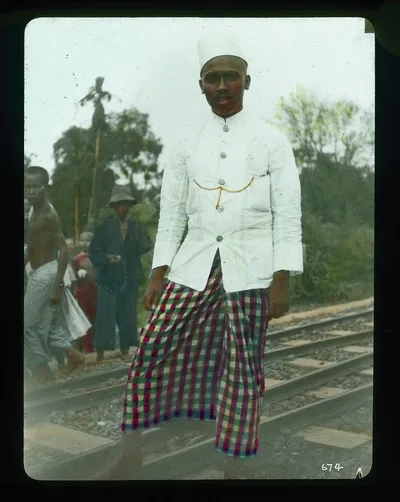 Railway guard standing on tracks, India, 1895