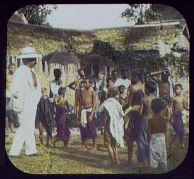 Joseph G. Pangborn standing with group of natives, India, 1895