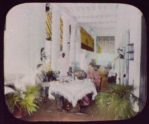A wealthy Indian merchant's home; man and woman at dining table…, 1895