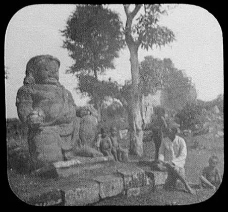 Javanese man and 4 children in front of Buddhist idol at Borobudur…, Java, Indonesia, 1895