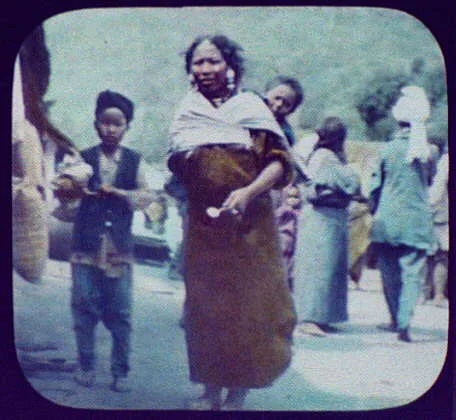 Mother carrying child in back pack, Java, Indonesia, 1895