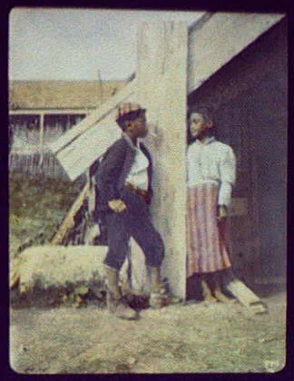 Young Maori boy smoking cigarette and talking to girl - Whakarewarewa, New Zealand, 1895