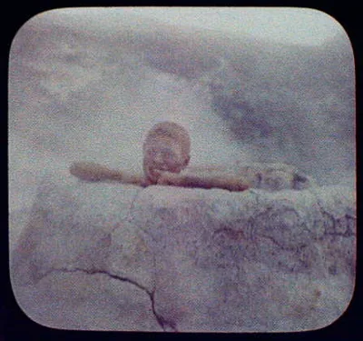 Pete in the "Brown Pot" - Maori boy inside small geyser, New Zealand, 1895
