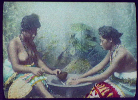 Two bare-breasted women around cooking pot, Oceania, 1895