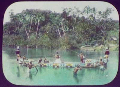 Warriors with spears in ornamented war canoe, Oceania, 1895
