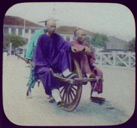 Shanghai - two Chinese men being carried in wheelbarrow, Yantai, China, 1895