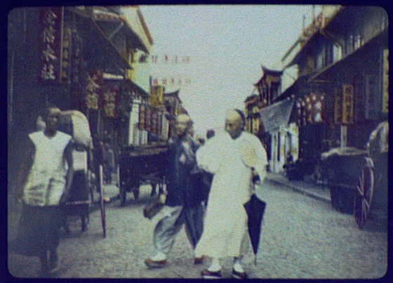 Chinese merchants on street, China, 1895