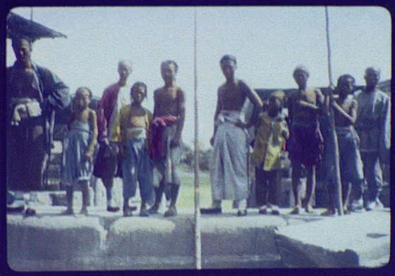 Group of men and boys standing, China, 1895