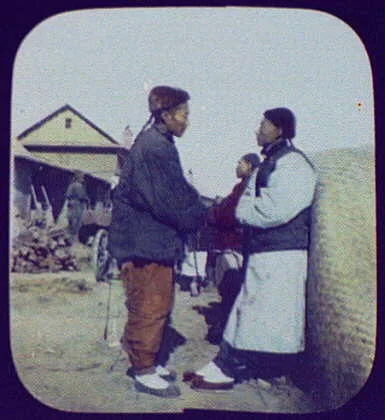 Two men conversing on street, China, 1895