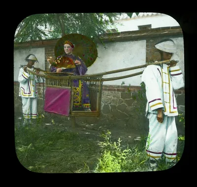 Chefoo - Mrs. Reese being carried in sedan chair, Yantai, China, 1895