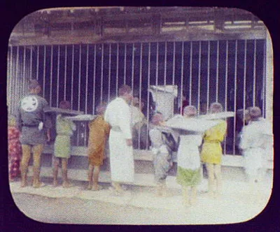 Miyajima - Japanese men and boys looking into Inn where WTC [i.e.…, Miyake Island, Japan, 1895