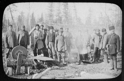Group of convicts standing by large pot of soup, Siberia, 1895