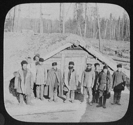 Convict camp - 10 men in front of sod house, Russia, Khabarovsk, 1895