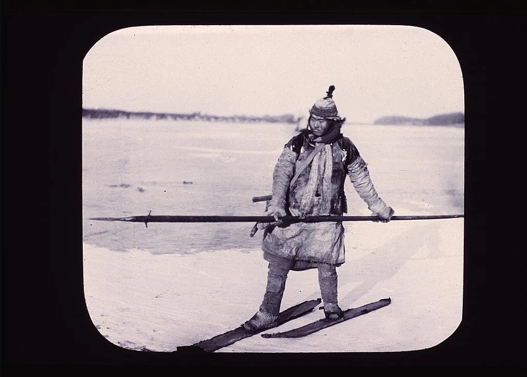 Goldi hunter on skis on ice, holding long spear, China, Amur River, Russia, 1895