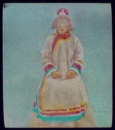 Goldes woman, wife of village chief, smoking pipe, Siberia, 1895