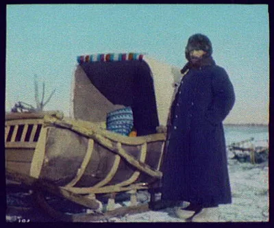 Karamboff, our "Courier", standing beside sledge, Siberia, 1896