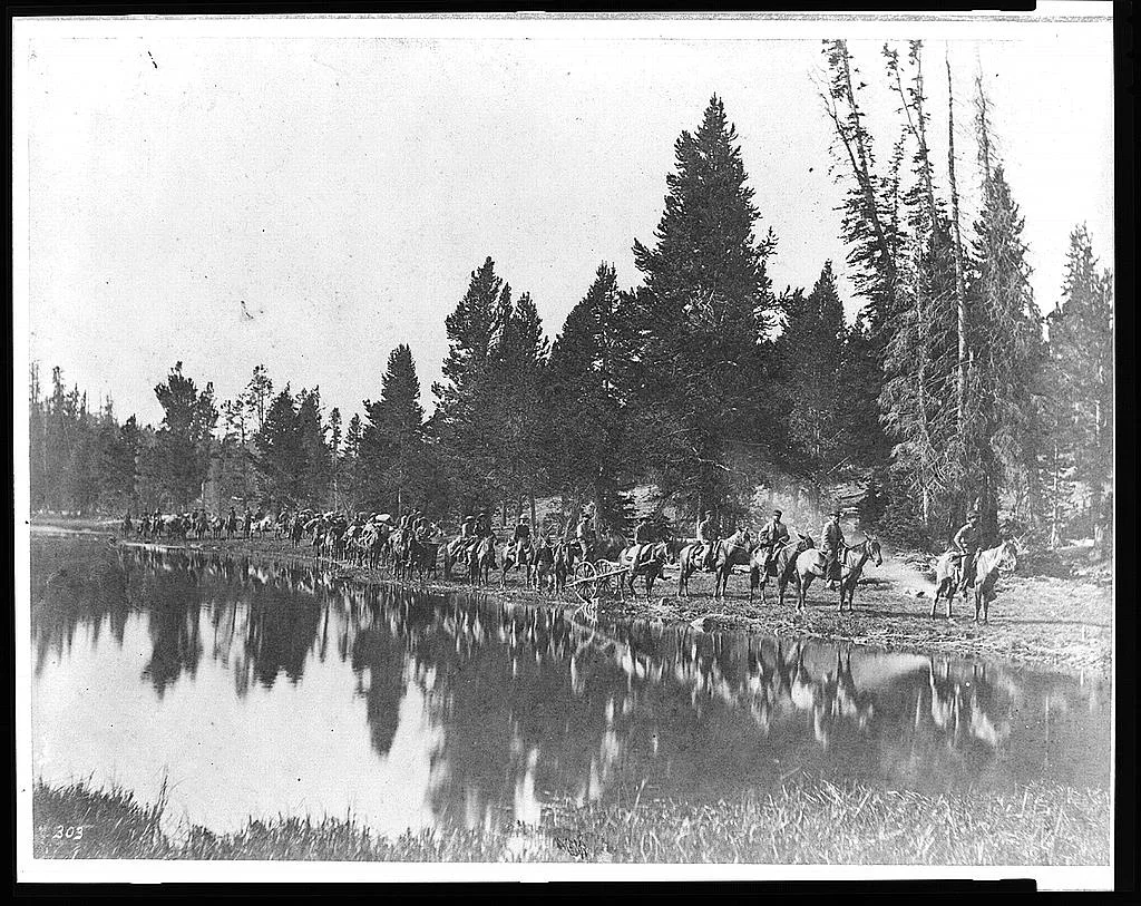 [U.S. Geological Survey pack train on trail along the Yellowstone…, Wyoming, Yellowstone River, 1871